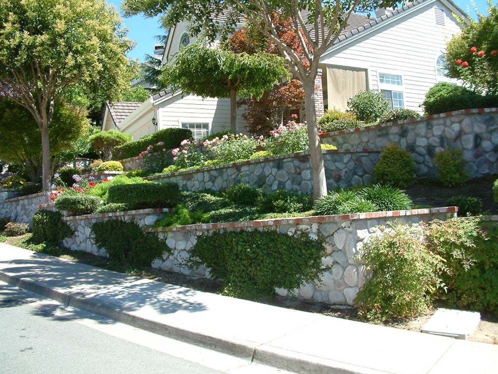 Rock Retaining Wall with Brick Cap